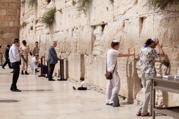 Jewish men are praying in Jerusalem at the Western (Wailing) Wall Jewish-pray-wall-temple-courtyard