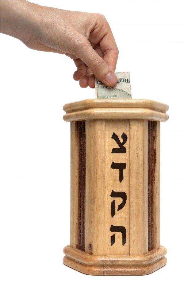 A pushka (offering box) with tzedakah tzedakah-pushka