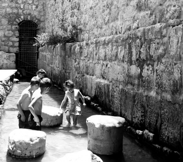 Children playing in the Pool of Siloam in Jerusalem Children-Playing-Pool-Siloam