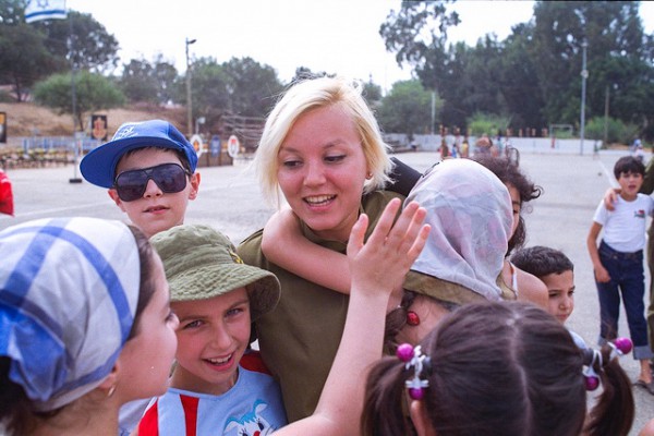 Soviet olim and soldiers pass the time together at an army base in Israel Soviet-olim-army-base-Israel
