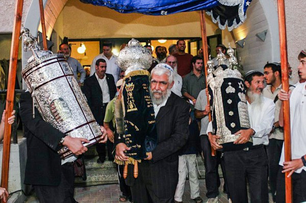 Orthodox men carrying Torah scrolls Orthodox men-Torah scrolls
