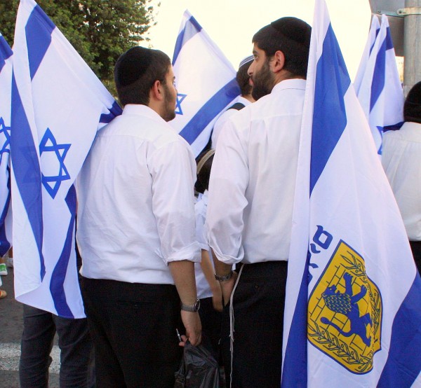 Jewish men carry flags during Jerusalem Day Jerusalem-Day-flags