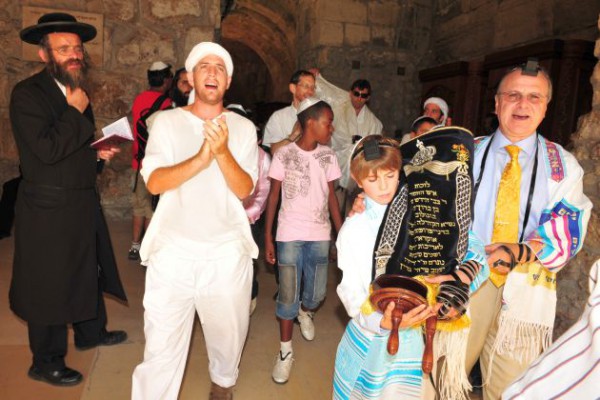 A 13-year-old Jewish boy carries the Torah during his Bar Mitzvah bar-mitzvah-Jerusalem