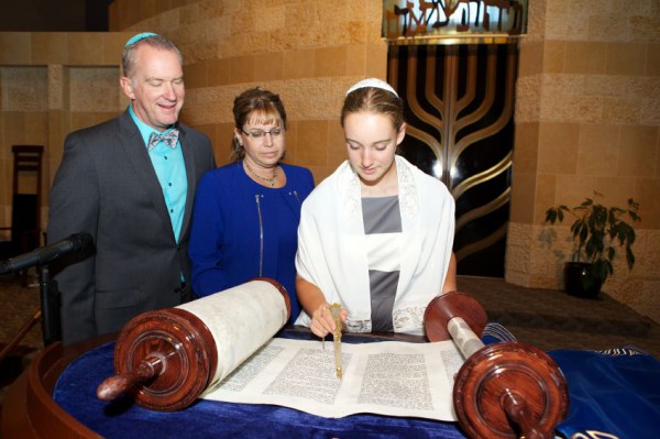A Jewish girl celebrates her Bat Mitzvah Torah scroll-bat-mitzvah-Jewish girl
