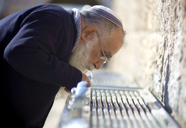 Drinking from a fountain at the Kotel Drinking from a fountain at the Kotel