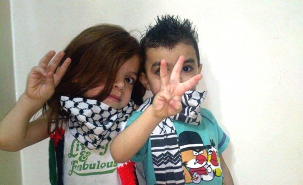 Children give three finger salute celebrating abduction and murder of three Israeli teens Children three fingered salute teenage kidnapped abduction murder