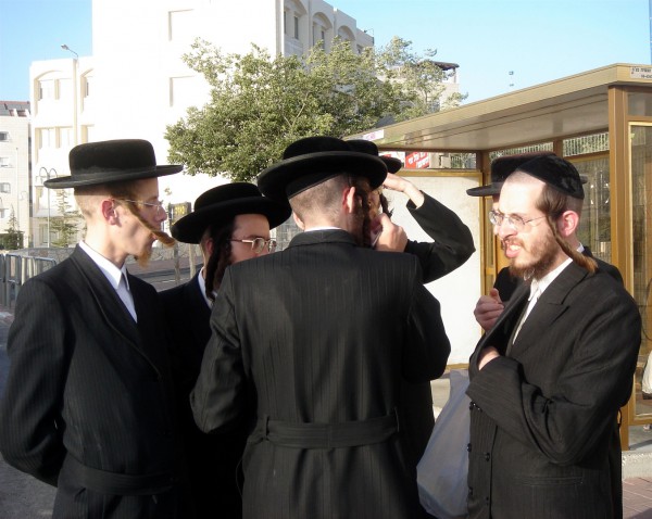 Ultra-Orthodox Jews at a bus stop men-bus-stop-Shabbat-festive-day-prayer-spending-time-family
