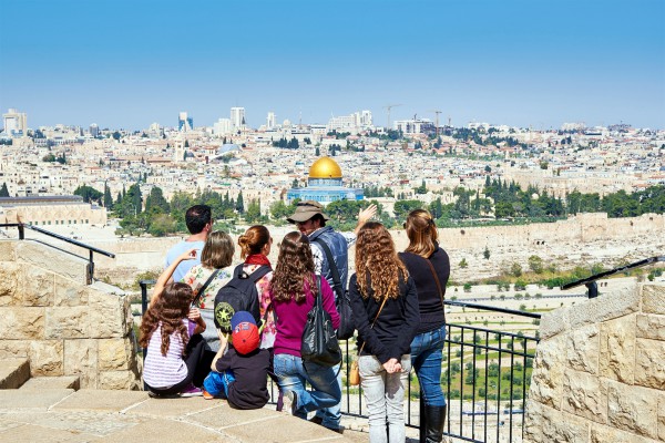 Tourists on the Mount of Olives look toward the Temple Mount where the First and Second Jewish Temples once stood. Currently the Muslim Dome of the Rock stands on the spot where they were located. Tourists on the Mount of Olives look toward the Temple Mount where the First and Second Jewish Temples once stood. Currently the Muslim Dome of the Rock stands on the spot where they were located.