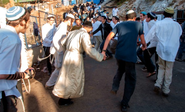 Orthodox Jewish men dance and rejoice on Lag BaOmer in Meron, the location of the tomb of Mishnaic-era sage Rabbi Shimon bar Yochai. Tens of thousands of visitors are drawn here during Lag BaOmer to pray and celebrate. Many camp out for days. Orthodox Jewish men dance and rejoice on Lag BaOmer in Meron, the location of the tomb of Mishnaic-era sage Rabbi Shimon bar Yochai. Tens of thousands of visitors are drawn here during Lag BaOmer to pray and celebrate. Many camp out for days.