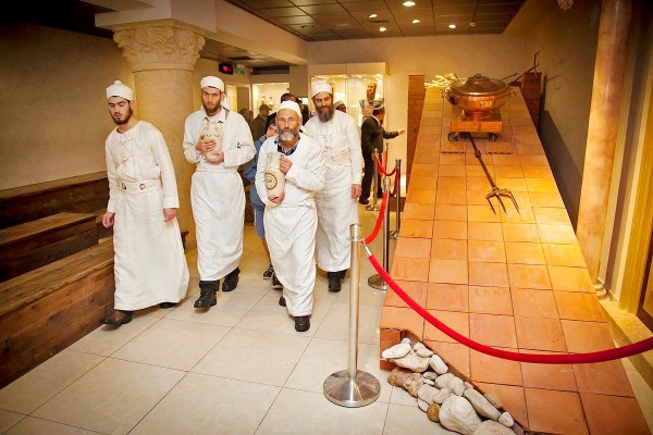 Four Kohanim walk beside a small modular altar in the Temple Institute that can be disassembled and placed within the Third Temple. Two Kohanim carry ceramic vessels filled with pure olive oil that will be stored for use in the Third Temple. On the ramp of the altar is the three-pronged fork for placing the offerings on the fire atop the altar. The copper vessel will be used to remove the previous day's ashes. (Source: Temple Institute Facebook). Four Kohanim walk beside a small modular altar in the Temple Institute that can be disassembled and placed within the Third Temple. Two Kohanim carry ceramic vessels filled with pure olive oil that will be stored for use in the Third Temple. On the ramp of the altar is the three-pronged fork for placing the offerings on the fire atop the altar. The copper vessel will be used to remove the previous day's ashes. (Source: Temple Institute Facebook).