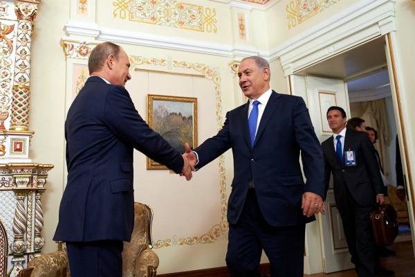 Putin Netanyahu handshake Israeli Prime Minister Benjamin Netanyahu (left) shakes hands with Russian President Vladimir Putin at the Novo-Ogaryovo state residence outside Moscow, Russia, September 21.