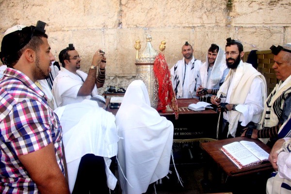 A 13-year-old Jewish boy prepares to read the Torah at the Western Wall. (Photo by Peter van der Sluijs) A 13-year-old Jewish boy prepares to read the Torah at the Western Wall. (Photo by Peter van der Sluijs)